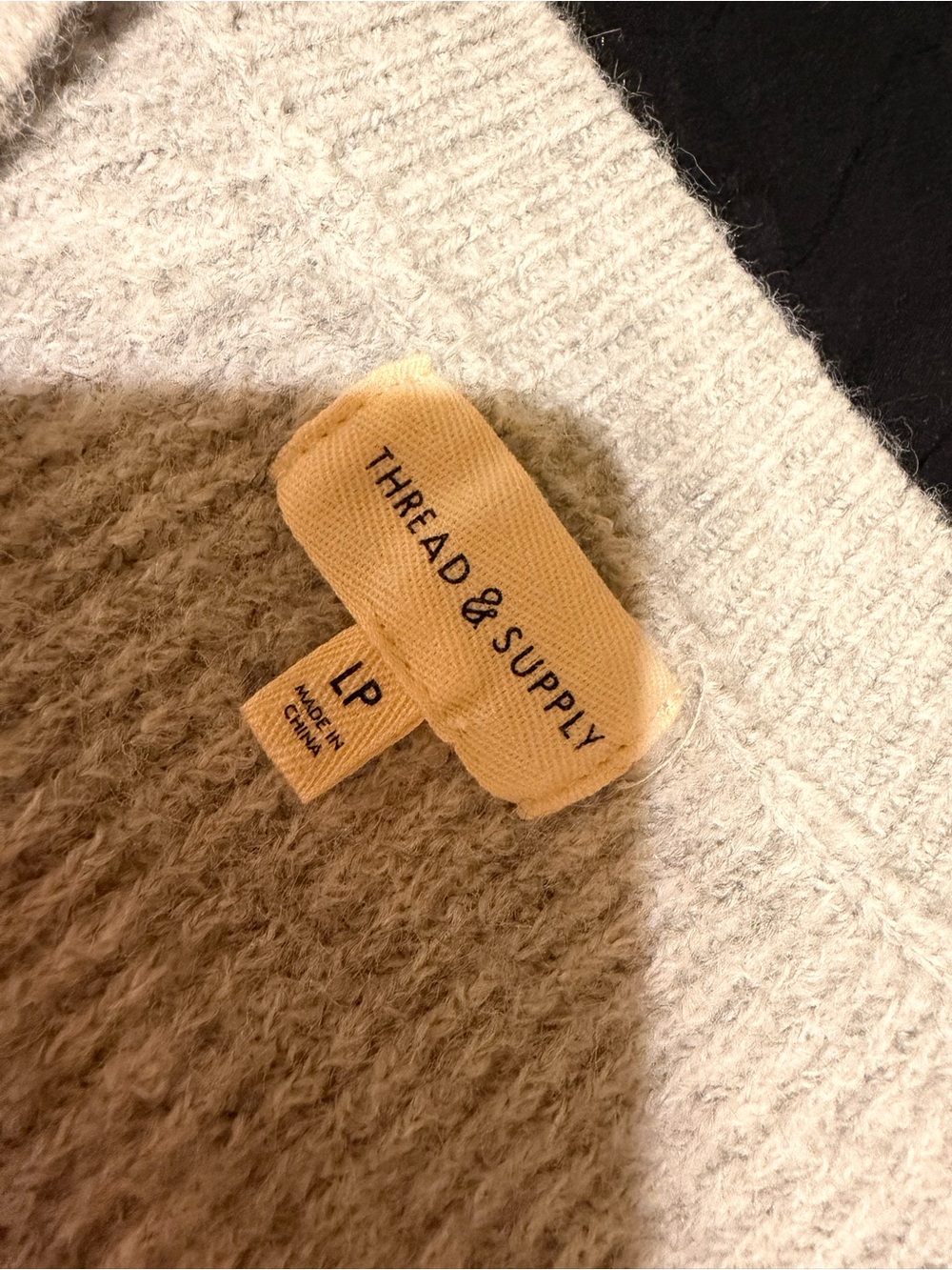 Thread & Supply Cream V-Neck Sweater with Tan Logo Tag